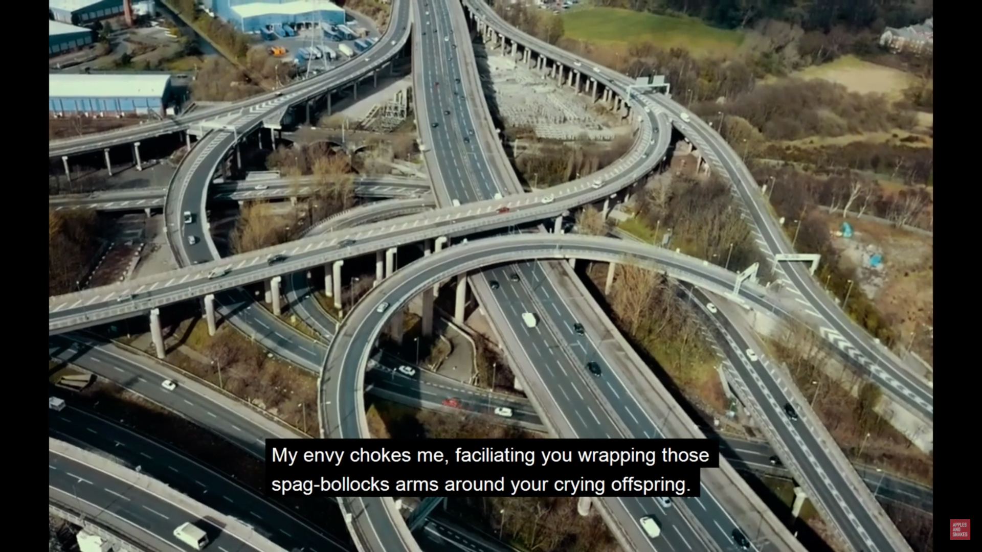 overhead view of a busy motorway filled with cars. a still from the poetry film 'Questionable' by Ryan Sinclair